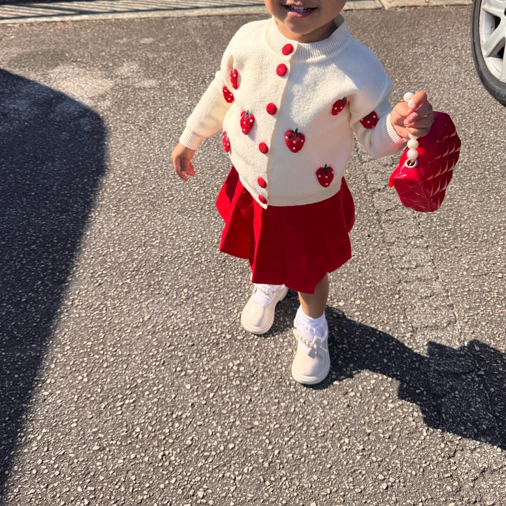 Cream Strawberry Button Cardigan with Red Pleated Skirt